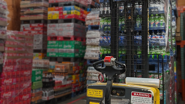 backroom with many pallets of bottled drinks from vendors